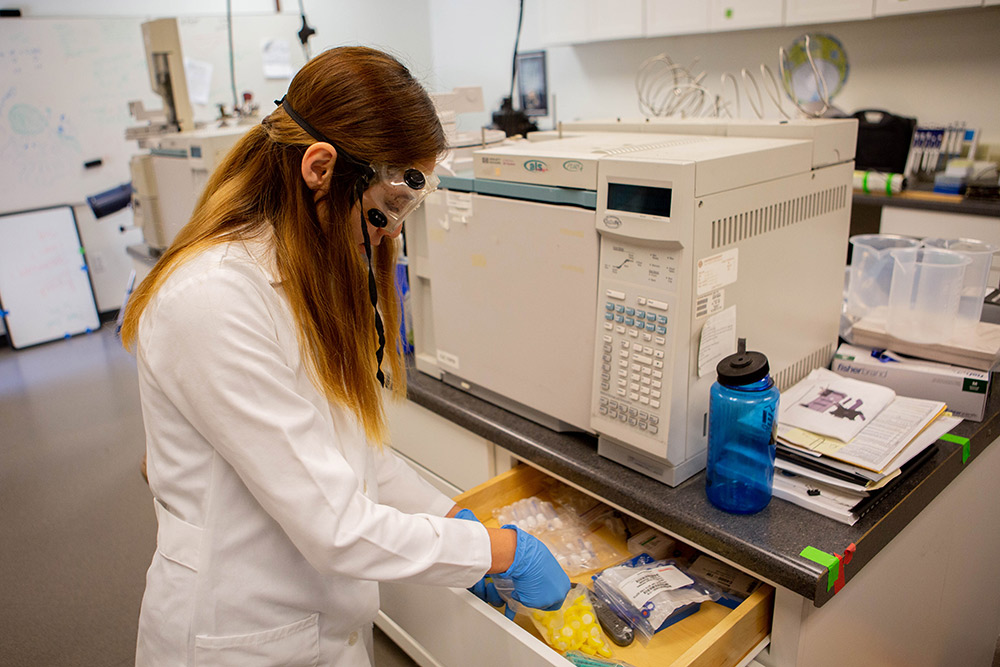 A Chemistry student prepares to use the equipment in Founders Hall.